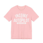 Pink unisex graphic t-shirt with “Income on Autopilot – Ask Me How” text, designed to spark conversation about building income online, on a white background 
